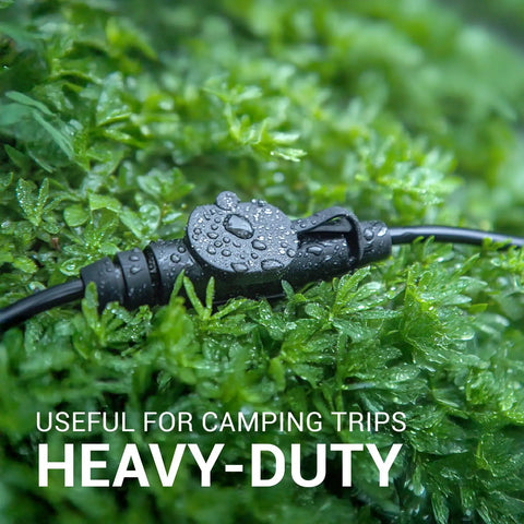 Super Versatile Heavy Duty 25 Ft Extension Cord Featuring 6 Multiple Outlets 16 Gauge 15 Amp 3 Prong Outdoor Indoor Power Cable Ideal For Christmas Lights Yard Decorations Camping Workshops And More In Black, shown in wet grass.