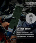 Front view of a gloved hand holding a green Everlit Survival 36-inch splint box outdoors
