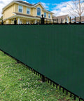 Privacy Fence Screen With Gloves 6X50Ft Heavy Duty 220Gsm HDPE Blockage 98 Percent For Outdoor Wall Garden Yard Backyard Dark Green UV Protection Easy Installation With Grommets in garden setting