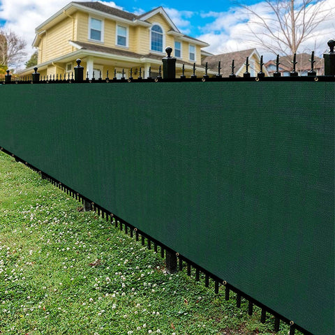 Privacy Fence Screen With Gloves 6X50Ft Heavy Duty 220Gsm HDPE Blockage 98 Percent For Outdoor Wall Garden Yard Backyard Dark Green UV Protection Easy Installation With Grommets in garden setting