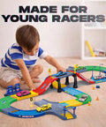 Child playing with First Speed Race Track Builder Playset For Kids With Six Diecast Cars And Accessories, Easy Snap Together Raceway Kit