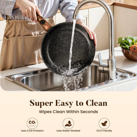 Removable Handle Induction Pots And Pans Set 10 Piece Nonstick Cookware Black Granite being rinsed in a sink