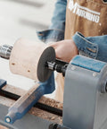 Four Prong Spring Loaded Spur Drive Center 2MT for Wood Lathe in action, securing wood piece tightly to prevent slippage
