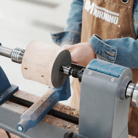 Four Prong Spring Loaded Spur Drive Center 2MT for Wood Lathe in action, securing wood piece tightly to prevent slippage