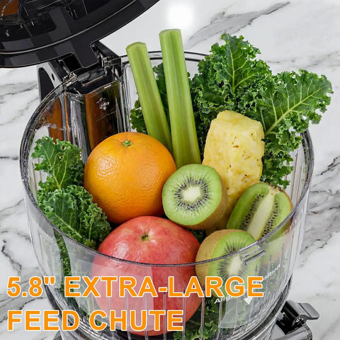 Kiamith 300W Cold Press Juicer With Huge 5.8 Inch Wide Feed Chute For Whole Produce, filled with fruits and greens.