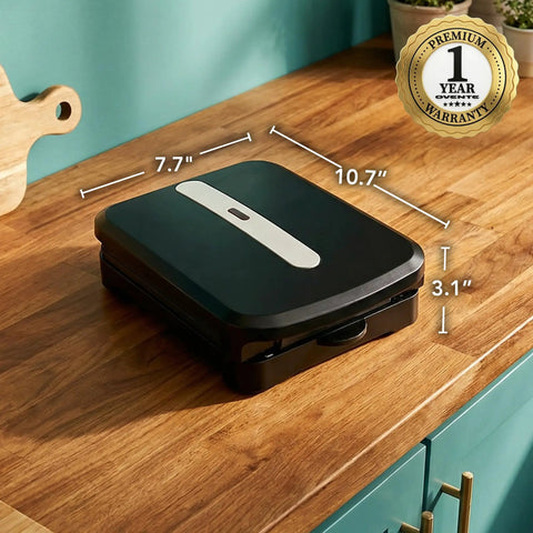Ovente Two Serving Electric Indoor Grill And Panini Press Compact Contact Maker For Juicy Steaks Bold Smoky Flavor No Outdoor Mess Black Kitchen Appliance on wooden countertop, dimensions shown.