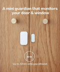 Zigbee Door And Window Sensor from 3 Pack installed on wooden door for smart home security, showing size and functionality.