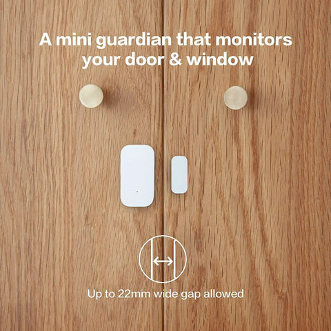 Zigbee Door And Window Sensor from 3 Pack installed on wooden door for smart home security, showing size and functionality.