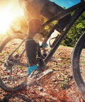 Cyclist on mountain trail showcasing Bike Ball Crank Bearing 38mm 7 Balls 4 Pack Stainless Steel Bicycle Bearings Replacement.