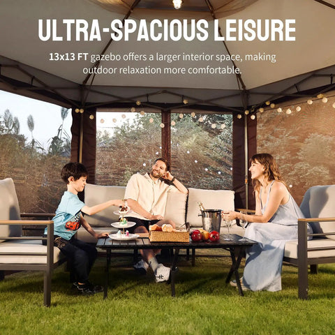 Family relaxing under 13x13 pop up gazebo with mosquito netting Centerlok six sided canopy, beige coffee color, backyard setting.