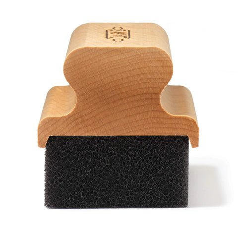 Cutting Board Oil And Wax Applicator With Ergonomic Handle For Butcher Block Wood Surfaces in maple hardwood angle view