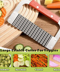 FANTEXY crinkle cutter with red wooden handle and metal blade for slicing potatoes and veggies.