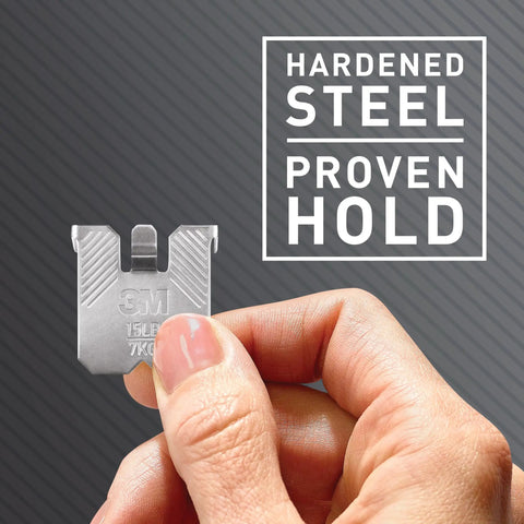 Heavy Duty Drywall Picture Hangers Six Pack Holds Up To 15 Lbs Each With No Studs Required For Hassle Free Room Refresh and Office Display Featuring Sturdy Steel Build For Bold Wall Art, steel hook in hand.