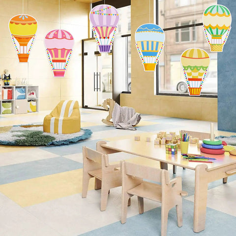 Classroom decor with 60 Colorful Hot Air Balloon Paper Cutouts With 120 Glue Dots, 6 Styles, 4.8 x 7.2 Inch Name Tags hanging from ceiling.
