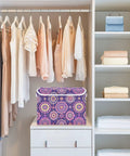Totally Solid Collapsible Storage Bins With Lids And Heavy Duty Handles For Bedroom Closet Organization in a closet with clothes.
