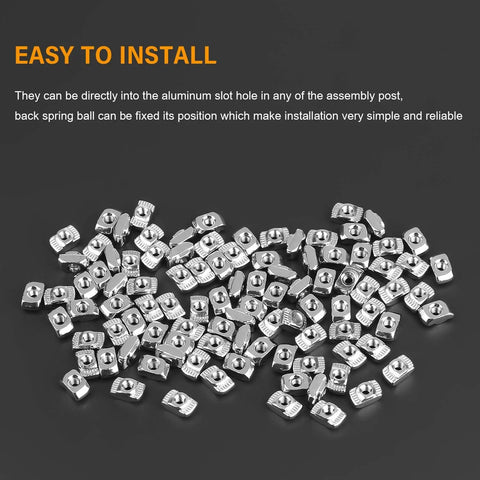 100 Pack M3 T Slot Hammer Head Nuts For 2020 Aluminum Profile Heavy Duty Nickel Plated Steel Fasteners closely arranged on a black background.
