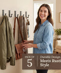 Heavy Duty Kickass Cast Iron Wall Hooks 5 Pack Handmade Blacksmith J Hooks in use, holding coats and bags indoors.