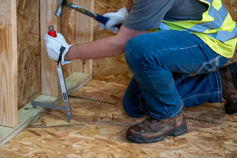 Worker using Little PeeVee Sill Plate Tool For Construction Walls, 18 Inch Length Steel Puller With Ergonomic Grip, Nailing Aid
