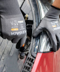 Worker using W1 PU Coated Work Gloves For Men And Women With Superior Grip And Touchscreen Compatibility All Day Comfort to assemble car parts