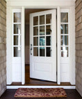 Matte Black 2-Way Adjustable Karsen Handleset For Front Entry Doors on white paneled door, reversible swing, exterior view