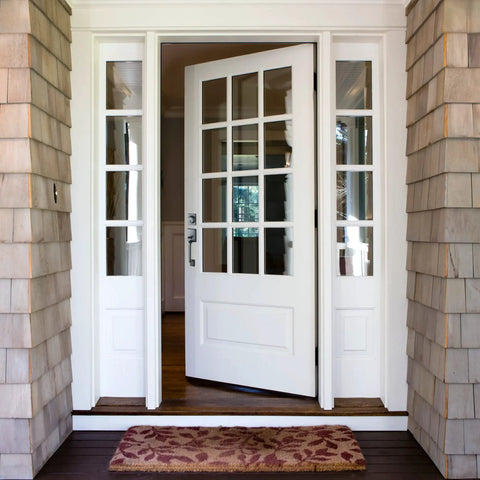 Matte Black 2-Way Adjustable Karsen Handleset For Front Entry Doors on white paneled door, reversible swing, exterior view