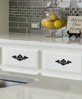 8 Pack Matte Black Drop Bail Drawer Pulls Two And A Half Inch Center Vintage Cabinet Handles installed on white kitchen drawers