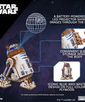 R2 D2 3D Wooden Puzzle Kit For Adults With Moving Parts And LED Projection Light shown in space setting.