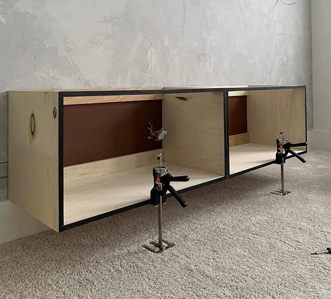 Heavy Duty Hand Jack Lift Tool for Cabinets, Flooring, Windows and More under wooden cabinet during installation on carpet