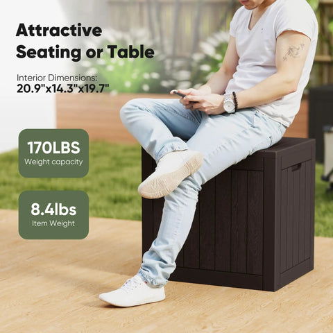Person sitting on Weatherproof 31 Gallon Deck Box With Lockable Lid For Outdoor Patio Garden And Backyard Storage