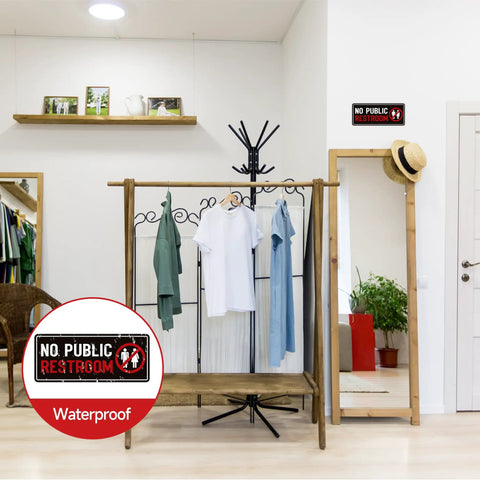 2 Pack No Public Restroom Signs Weatherproof Vinyl Stickers on a wall in a clothing store with wooden decor.