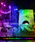 48 Ft Outdoor Patio Lights With Remote Dimmable RGB LED String Lights 8 Colors Including Red Green Blue Warm White And Cyan One Color At A Time 15 Shatterproof Bulbs Waterproof Cafe Bistro Party Mood Lighting illuminating a patio with outdoor furniture and fireplace
