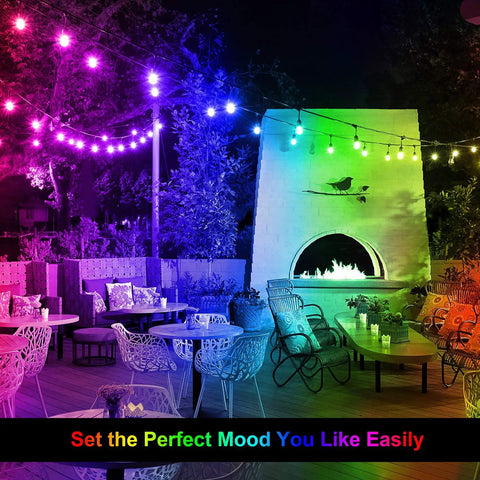 48 Ft Outdoor Patio Lights With Remote Dimmable RGB LED String Lights 8 Colors Including Red Green Blue Warm White And Cyan One Color At A Time 15 Shatterproof Bulbs Waterproof Cafe Bistro Party Mood Lighting illuminating a patio with outdoor furniture and fireplace