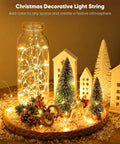 12 Pack Battery Operated Fairy String Lights With 7 Feet Silver Wire And 20 LED Warm White Twinkle Lights Eight Modes Waterproof For Mason Jars DIY Christmas Weddings Parties in a Christmas scene