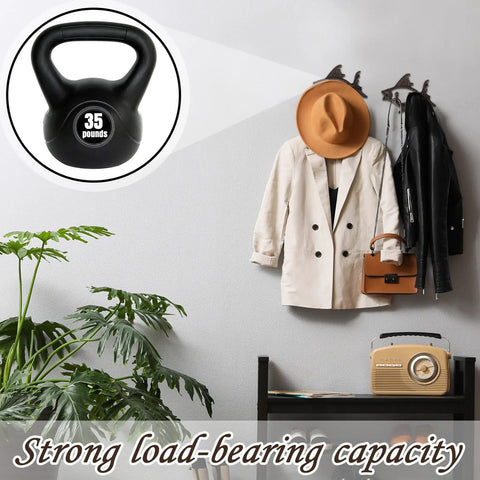 Dead Reliable Cast Iron Fish Wall Hooks 2 Pack display with a 35-pound kettlebell, holding coats and bags in an entryway.