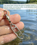 Hand holding Beefy Ball Bearing Swivel With Quick Clips Kit stainless steel snap in water, polished silver.