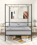 Full Size Metal Canopy Bed Frame With Modern Four Poster Silhouette And Sleek Headboard Matte Black Finish in stylish bedroom.