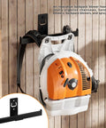 Heavy Duty Power Tool Wall Mount Organizer For Garage Storage Backpack Leaf Blower Holder shown storing an orange blower
