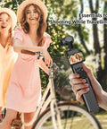 Person holding Juiced Up Battery Handle With Digital Display For DJI Osmo Pocket 4 And Pocket 3 during outdoor shoot