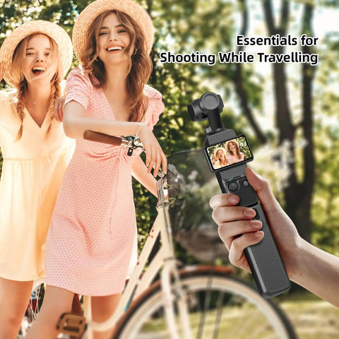 Person holding Juiced Up Battery Handle With Digital Display For DJI Osmo Pocket 4 And Pocket 3 during outdoor shoot