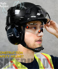 Hard Hat For Construction With Clear And Tinted Visors And Built In Earmuffs Hearing Protection Matte Black Industrial Safety Helmet Featuring 6 Point Suspension Worksite Ready All Day Comfort And Fully Adjustable Fit For Engineers And Builders.