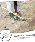 Versatile Manure Fork For Lawn Care And Farm Cleanup in use on grassy terrain, showing durable iron construction with wood handle.