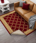 Living room with brown couch, red patterned rug, and 3 Ft By 11 Ft Rug Pad With Dual Surface Felt And Rubber Grip showing underneath.