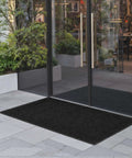 Workhorse Front Door Mat 5 by 3 Feet Indoor Outdoor With PVC Backing Striped Industrial Carpet Washable Entry Rug for Hallways Balconies and Garages Grey placed outside glass doors