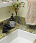 Waterfall Lav Faucet With Single Lever, Oil Rubbed Bronze Finish, Solid Brass Construction on granite countertop with soap