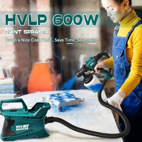 Person using Pro Home Paint Sprayer HVLP Electric Gun with 6ft hose and 3 nozzles for painting wooden surface indoors