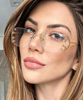Totally Chic Rimless Women Sunglasses With Dope Silver Metal Frames featuring clean lightweight rectangle shades on a model's face.