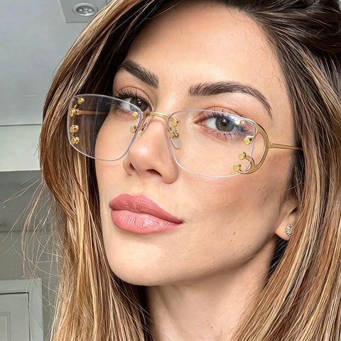 Totally Chic Rimless Women Sunglasses With Dope Silver Metal Frames featuring clean lightweight rectangle shades on a model's face.