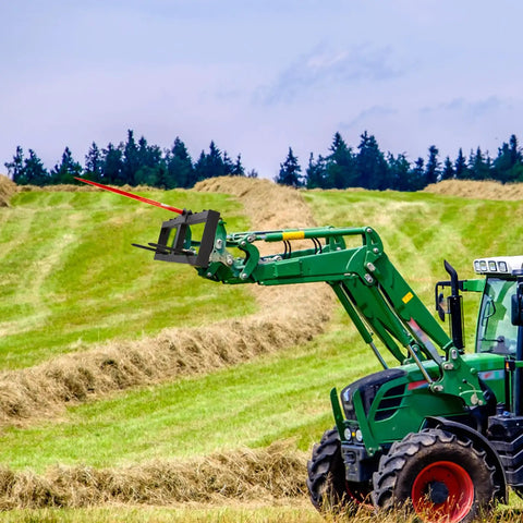 49 Inch Hay Spear Bale Fork With 1600 Lbs Load Capacity for Skid Steer Loader and Tractor Attachments in a field
