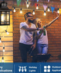 Couple enjoying evening under Motion Sensor Outdoor Porch Light With Dual GFCI Outlets Waterproof Wall Light in Aluminum
