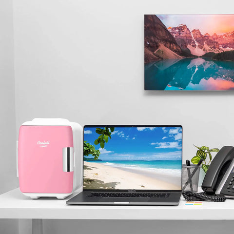 Dope Portable 4L Mini Fridge And Cooler Warmer placed on desk beside laptop, pink finish, 6 can capacity, USB AC DC ready